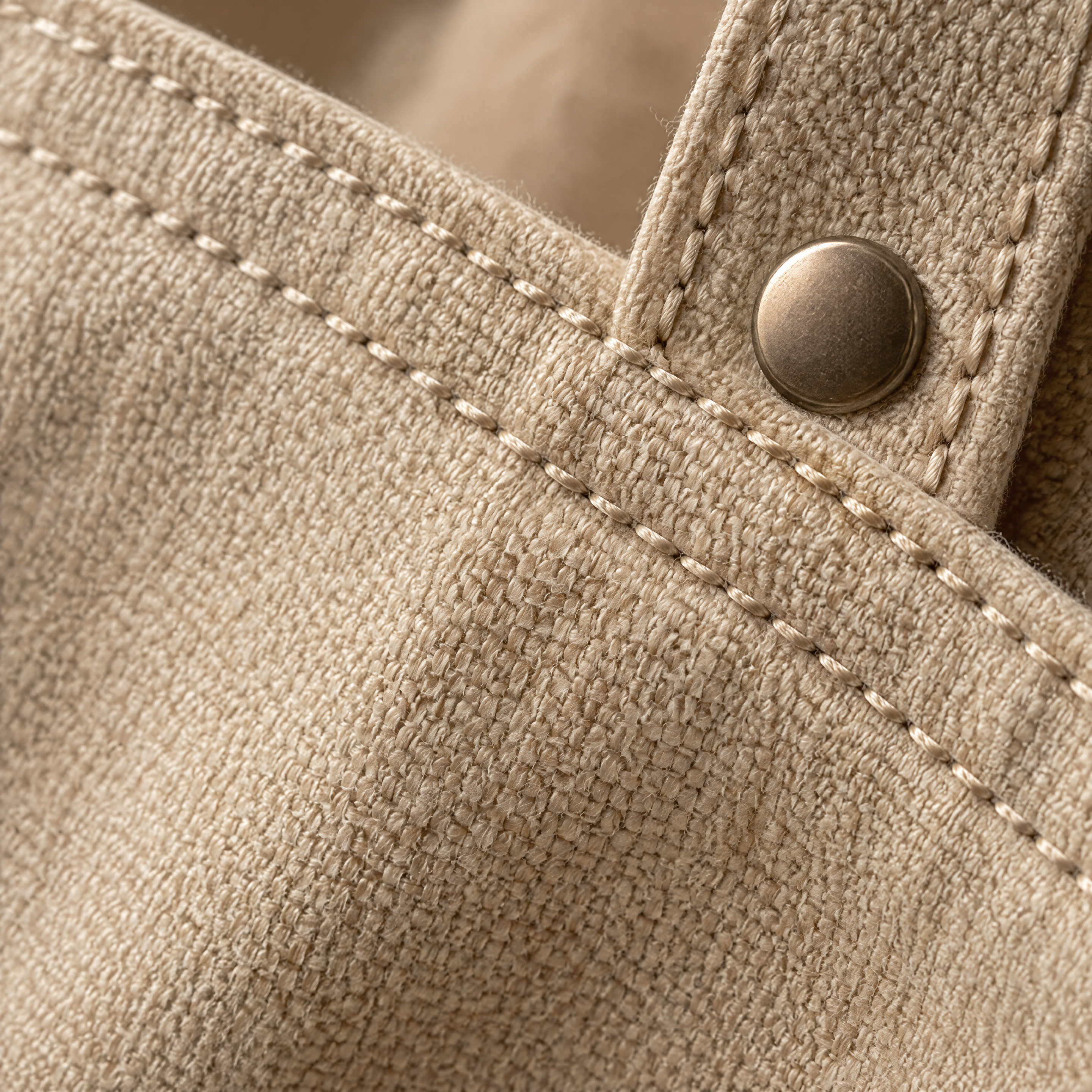 Extreme macro of woven canvas tote fabric with a double-stitched seam
